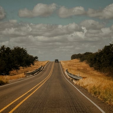 Long open road through the Texas Hill Country